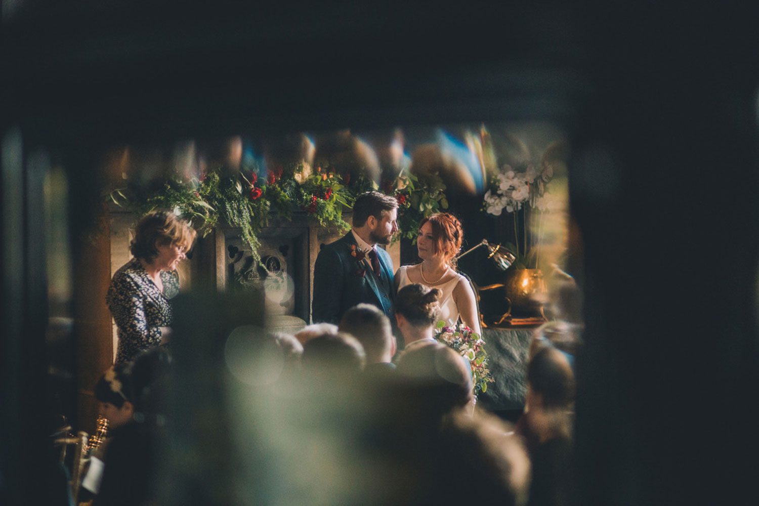 A blurred documentary style image of guests at a wedding taken by a wedding photographer