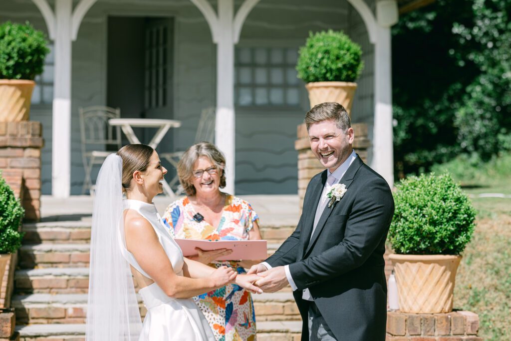 Independent celebrants: Fan brightly coloured dress with groom in tails and a laughing bride