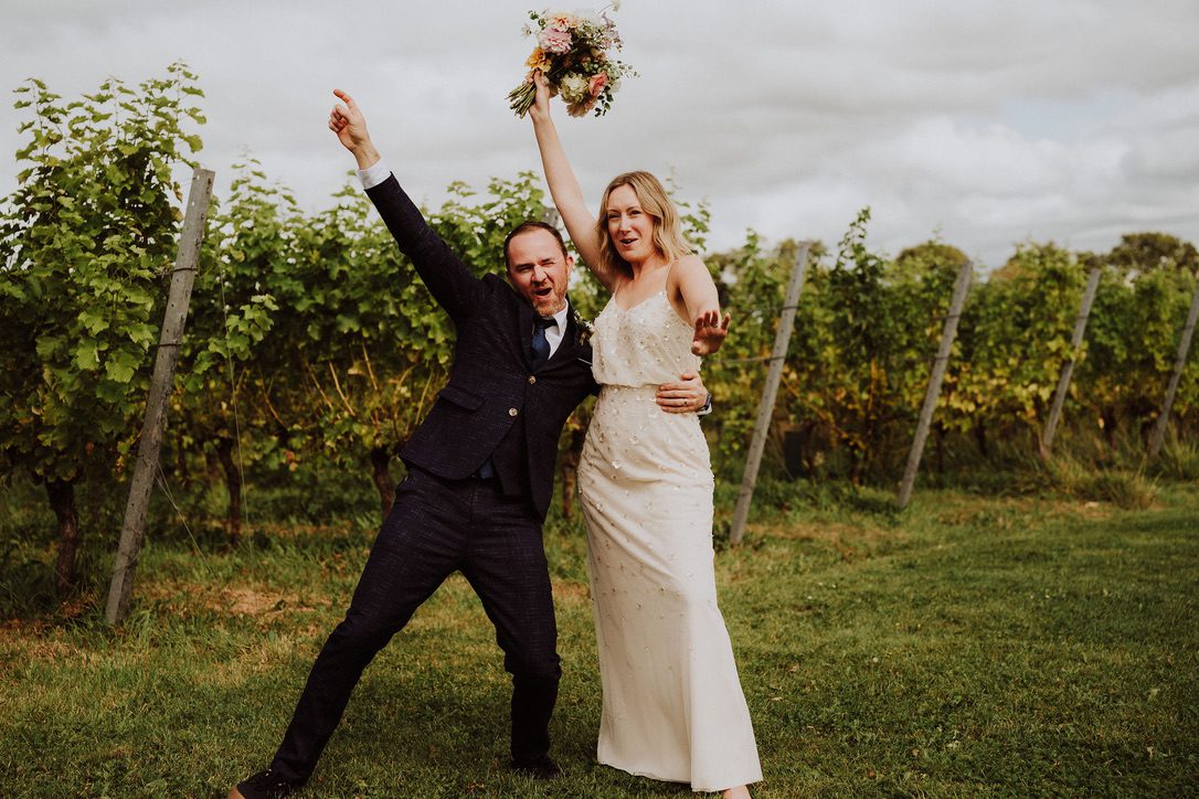 A bride and groom in a vineyard