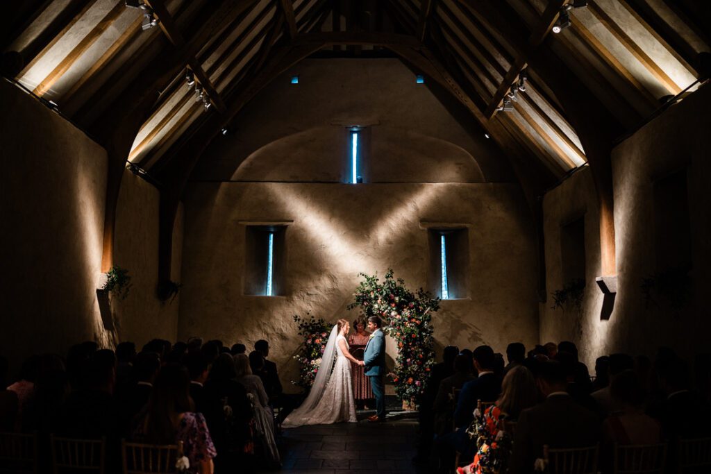the great barn looking up the aisle with the couple in the distance