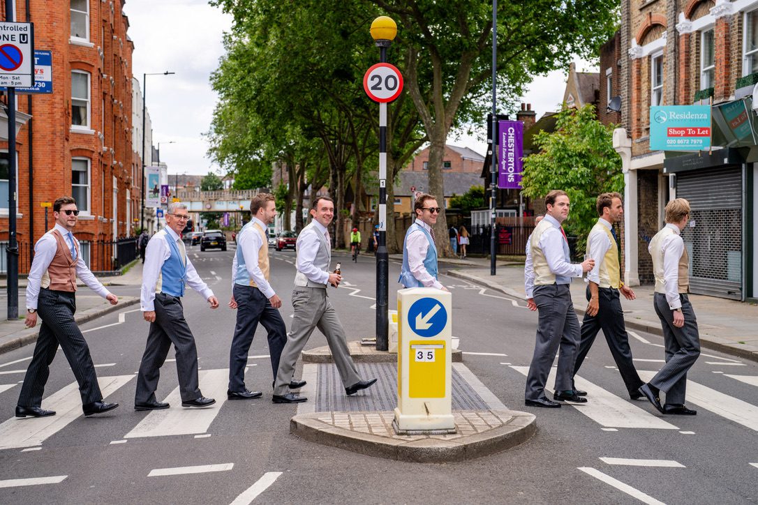 ushers walking across a london street