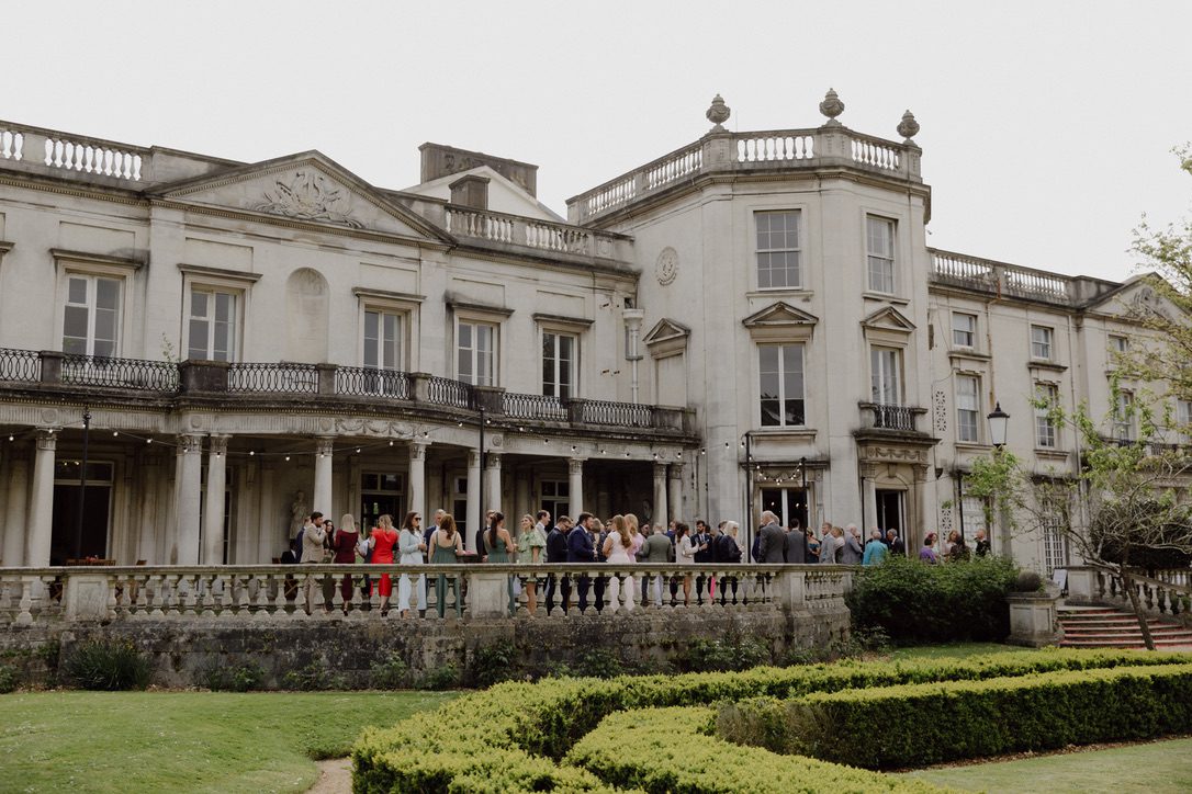 exterior image of Grove house with guests outside