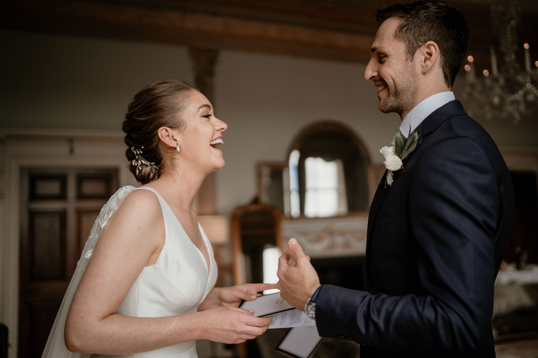 A bride and groom exchanging their wedding ceremony vows