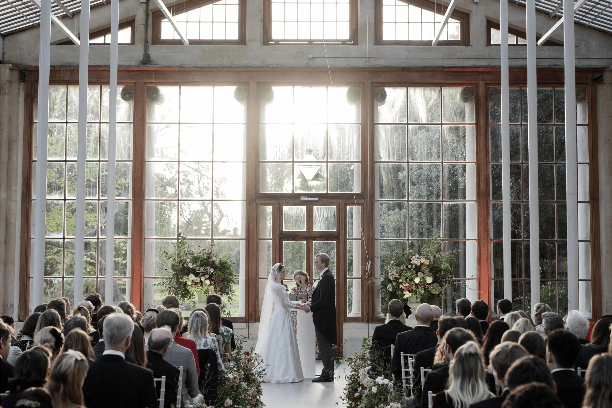 My celebrant philosophy as I conduct a ceremony in an orangery filled with guests and a bride and groom